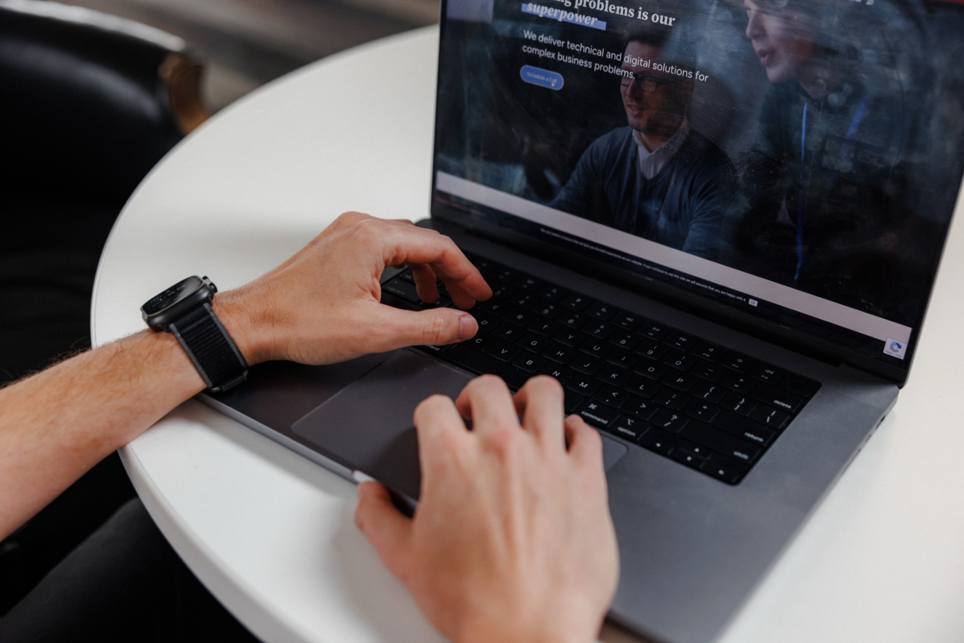 A visitor browsing the M&S Consulting website on a laptop